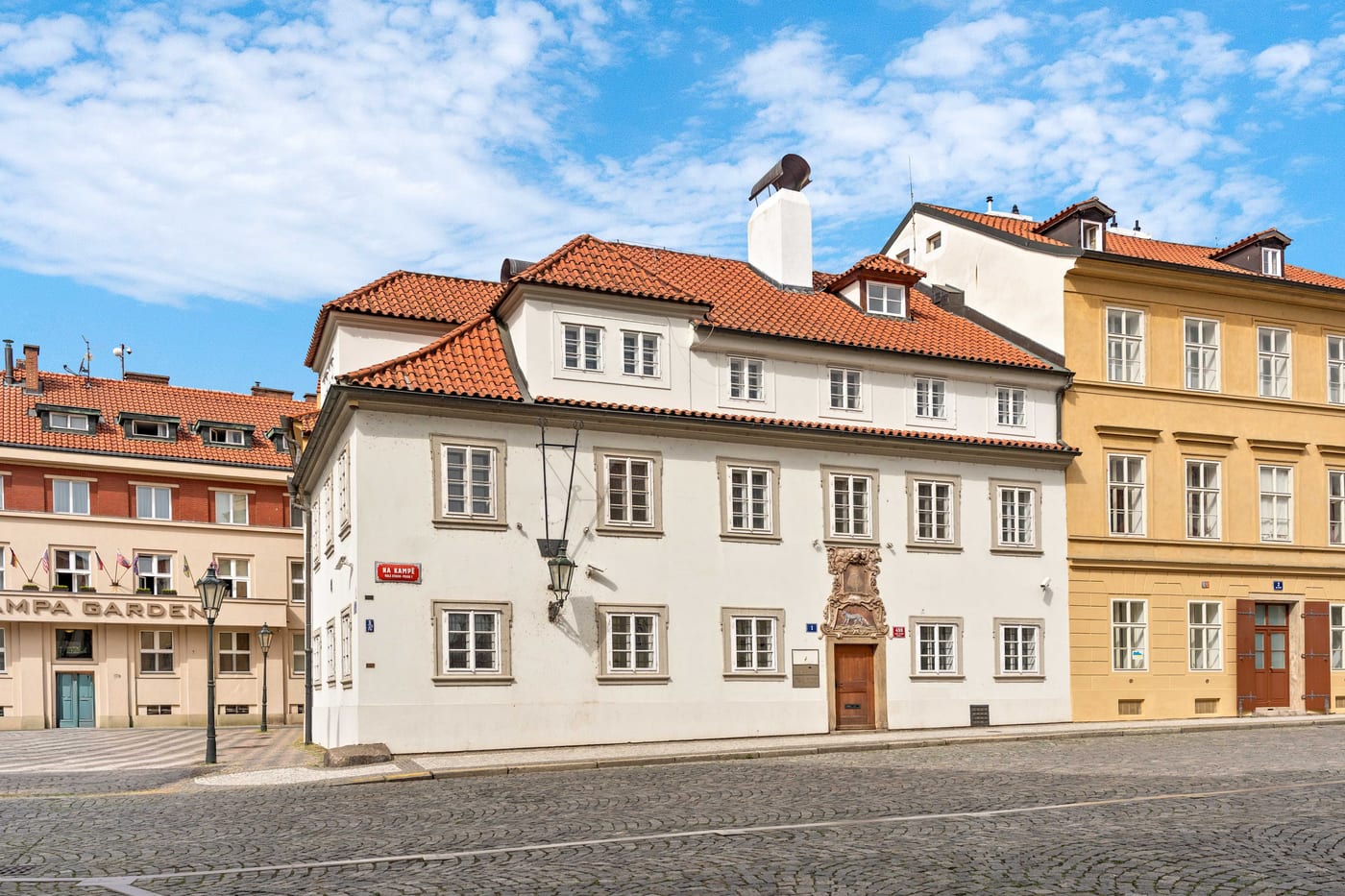 The Blue Fox House from the street, with the neighbouring houses of Na Kampě square