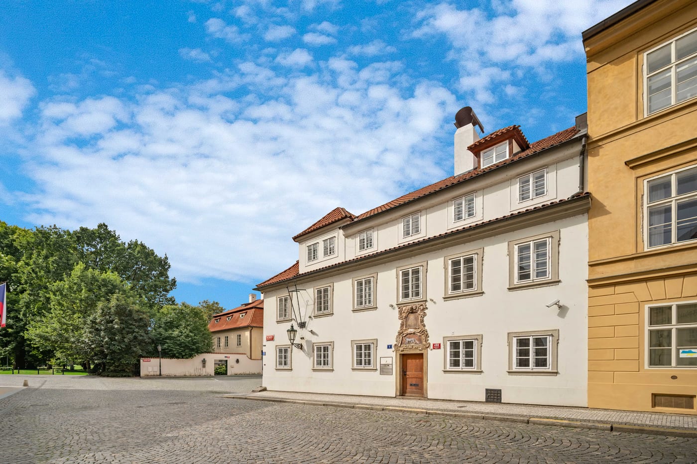 The Blue Fox House and the empty cobbled square Na Kampě
