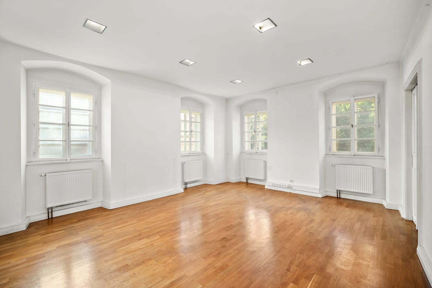 First-floor room with three windows and oak floor